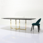 Kross table with barrel-shaped top 200 x 110 cm in black guinea marble and gold chrome base